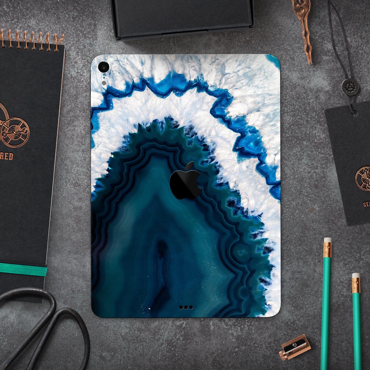 Bright Blue Agate Slice skin decal for Apple iPad Pro, showcasing vibrant blue and natural stone patterns.