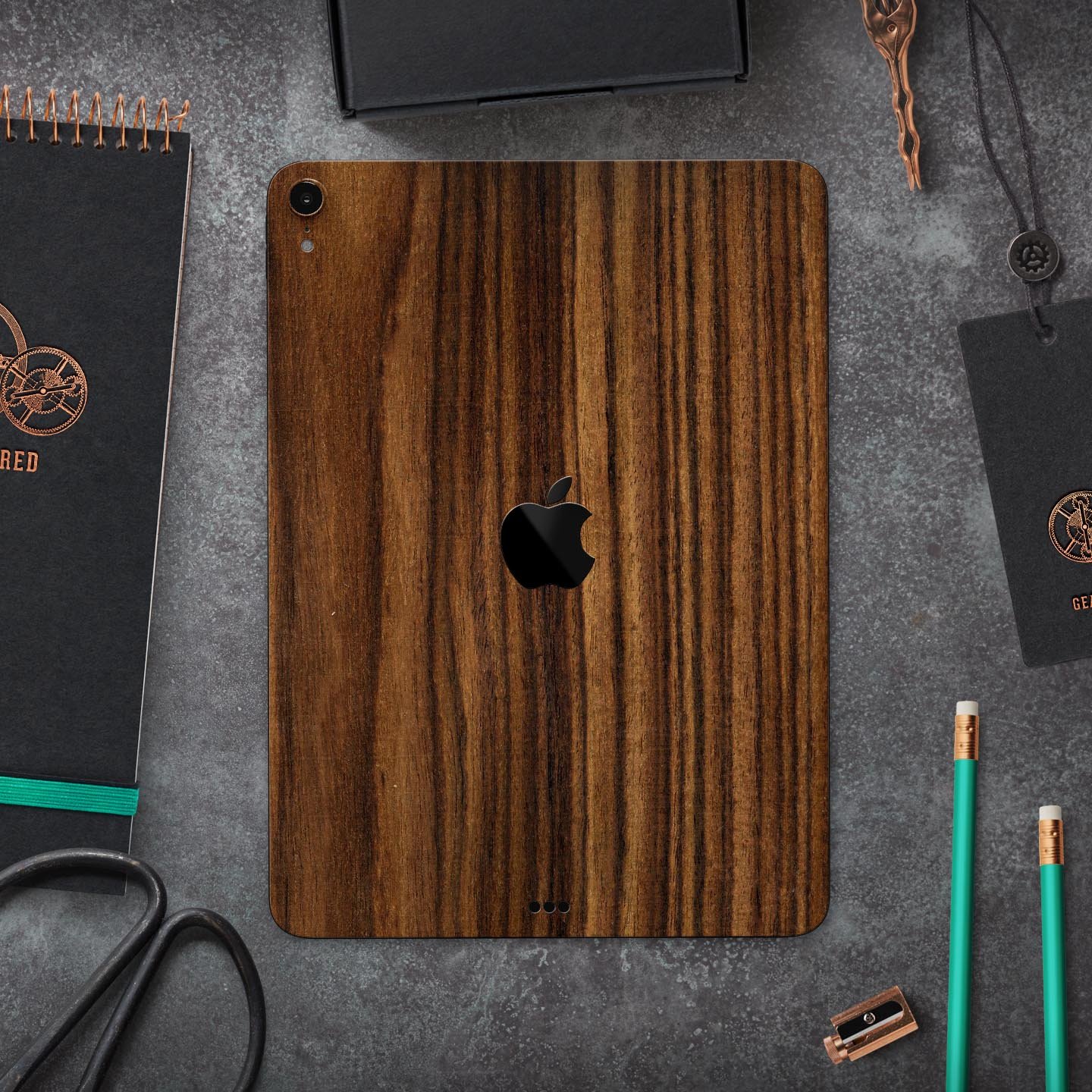 Bright Ebony Woodgrain skin decal for Apple iPad Pro, showcasing a sleek wood texture design for stylish protection.