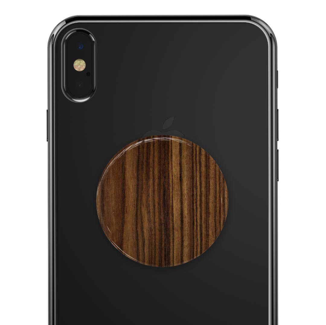 Bright Ebony Woodgrain Skin Kit for PopSockets, showcasing a stylish woodgrain design on a smartphone grip.