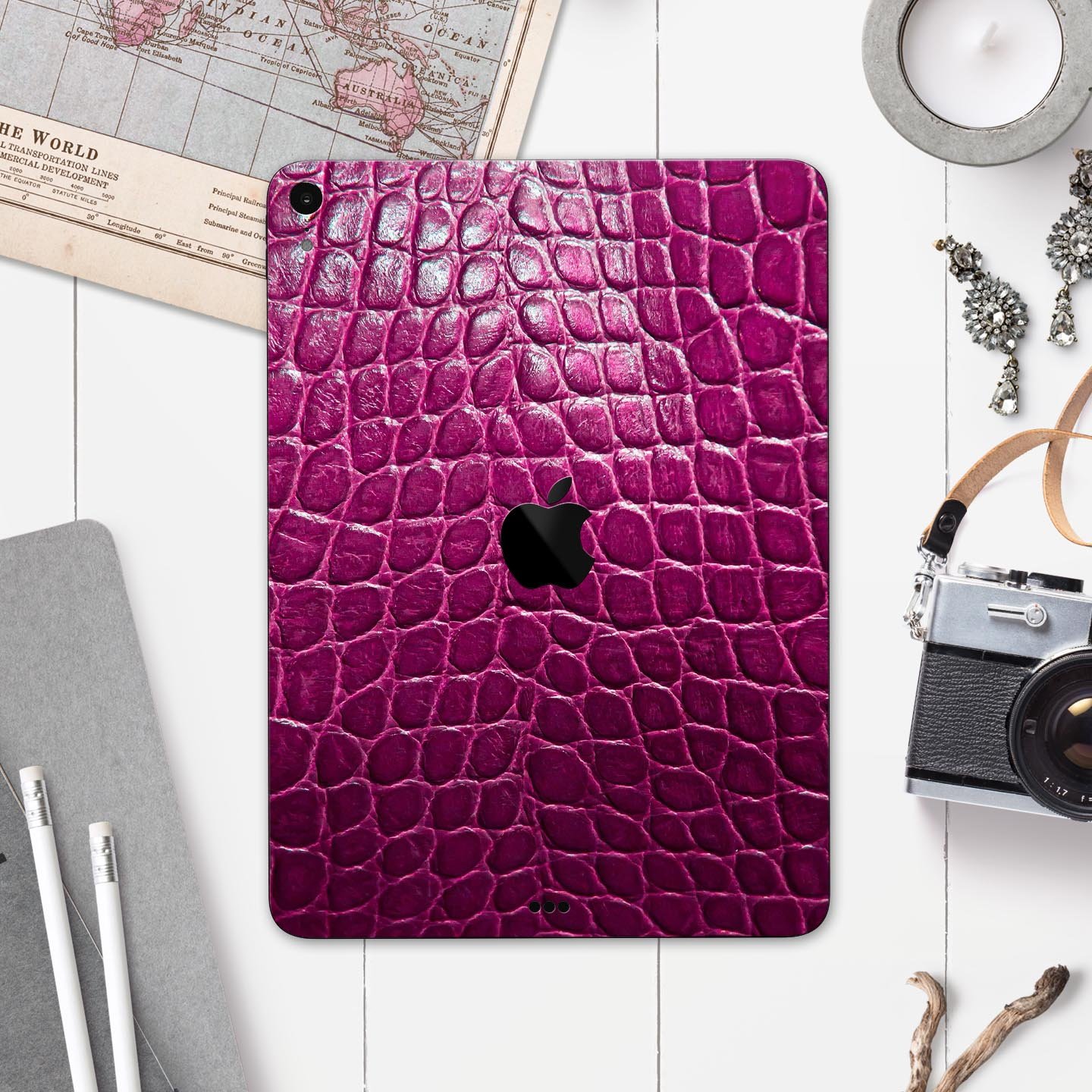 Bright magenta alligator skin decal for Apple devices, showcasing a textured design and vibrant color for stylish protection.