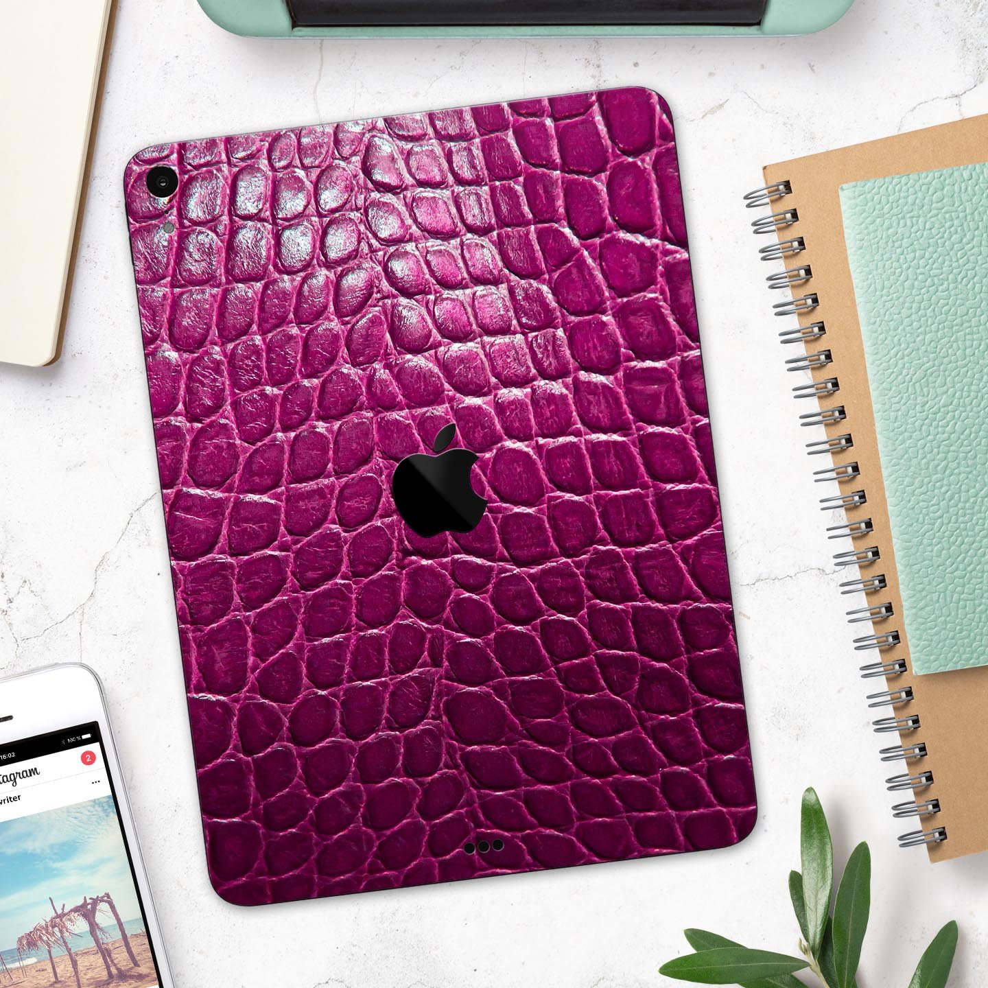 Bright magenta alligator skin decal for Apple devices, showcasing a textured design and vibrant color for stylish protection.