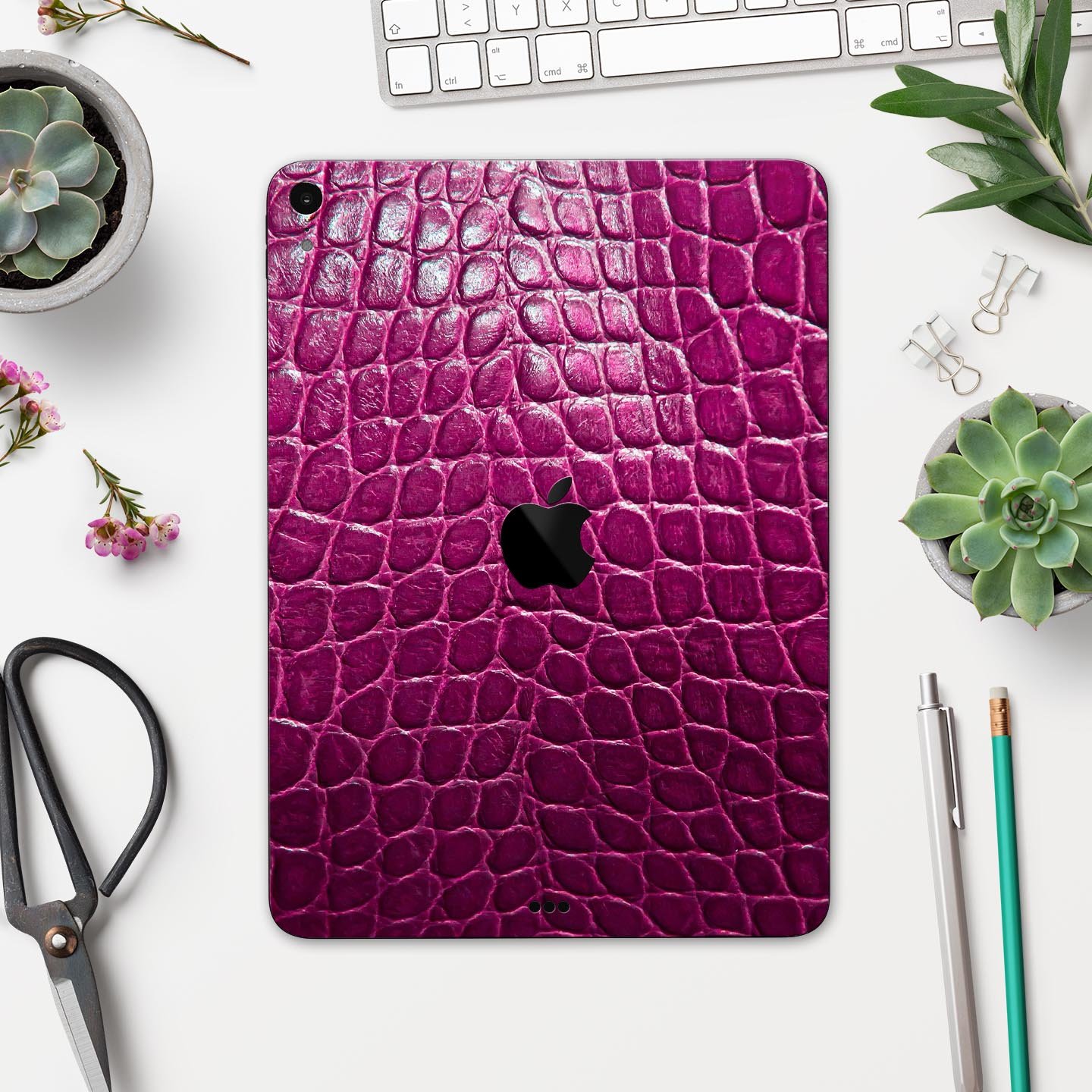 Bright magenta alligator skin decal for Apple devices, showcasing a textured design and vibrant color for stylish protection.