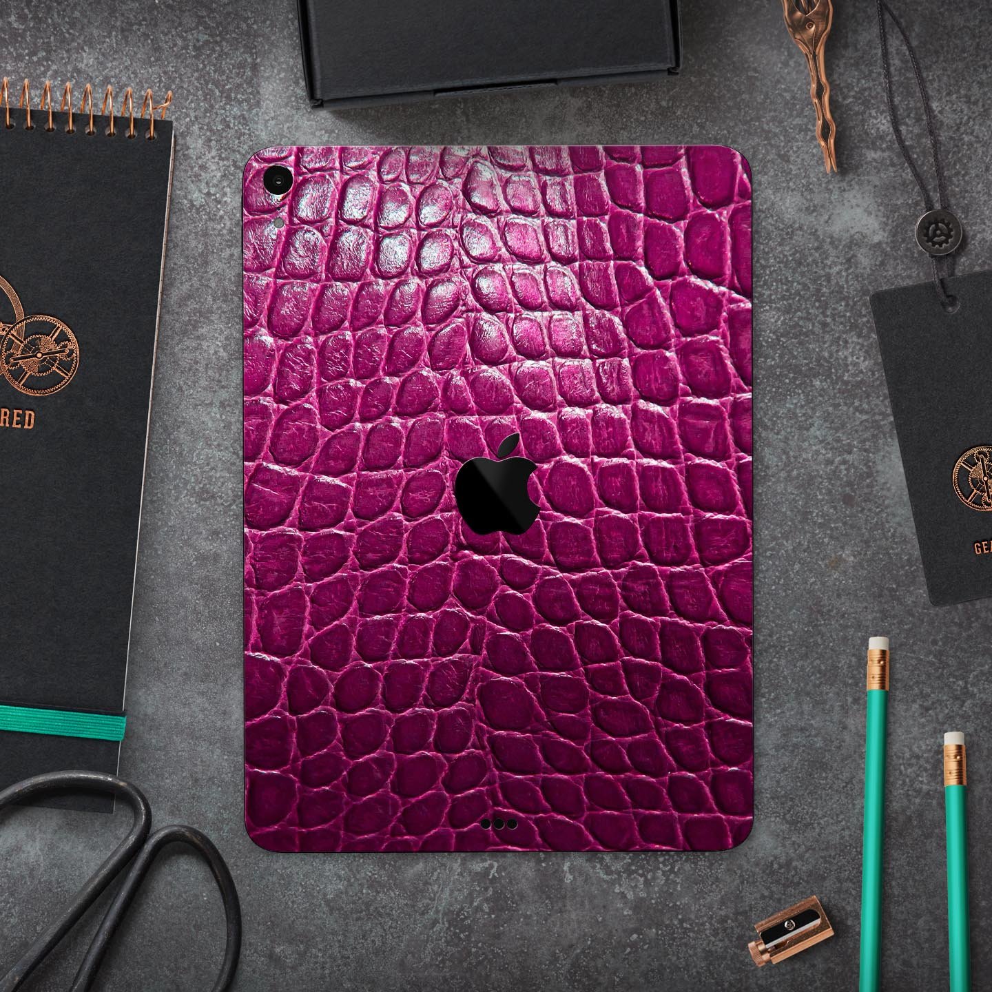 Bright magenta alligator skin decal for Apple devices, showcasing a textured design and vibrant color for stylish protection.