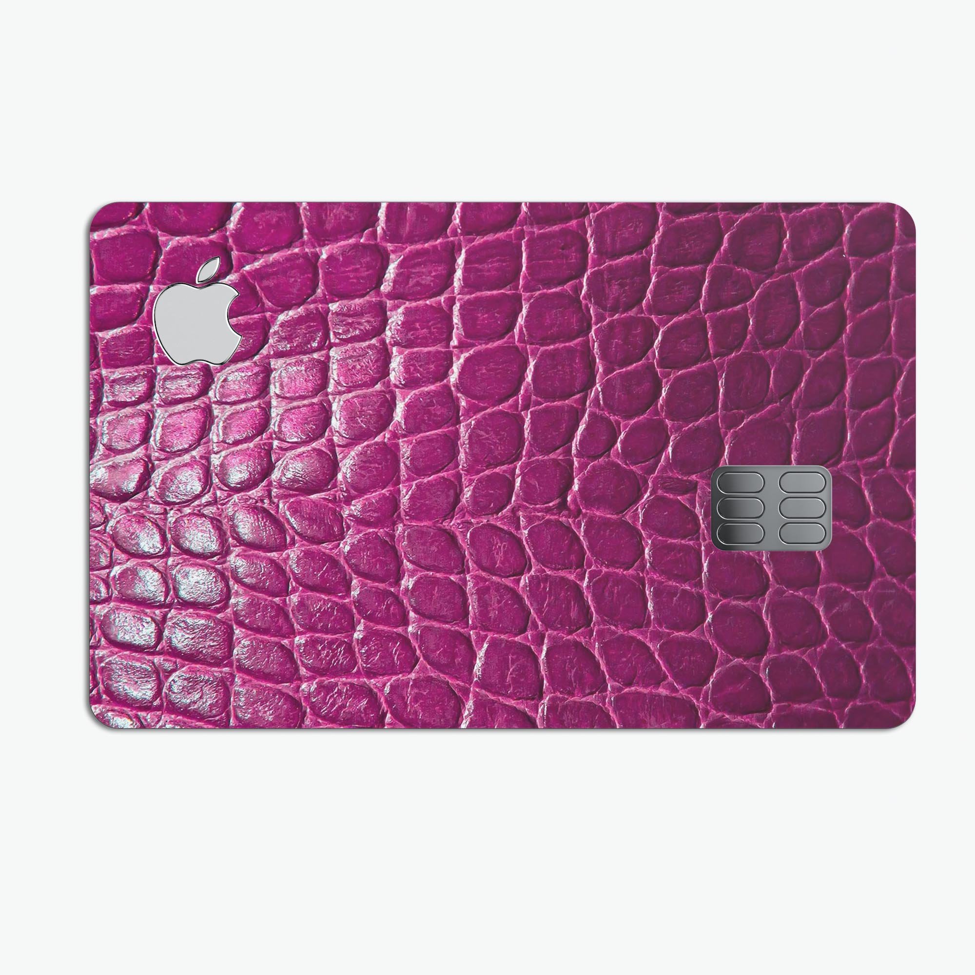 Bright magenta alligator skin decal skin-kit for Apple Card, showcasing its vibrant color and textured finish.