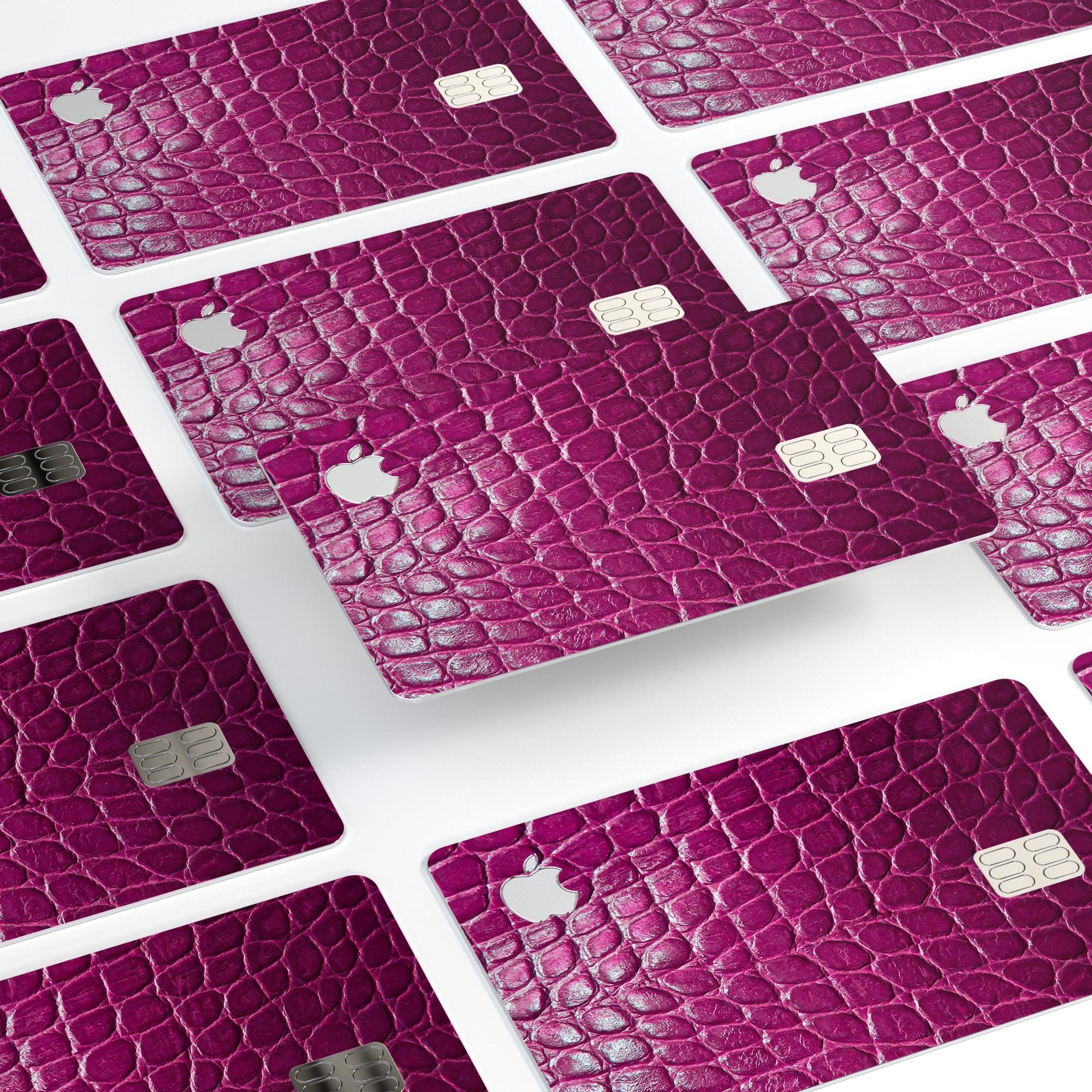 Bright magenta alligator skin decal skin-kit for Apple Card, showcasing its vibrant color and textured finish.