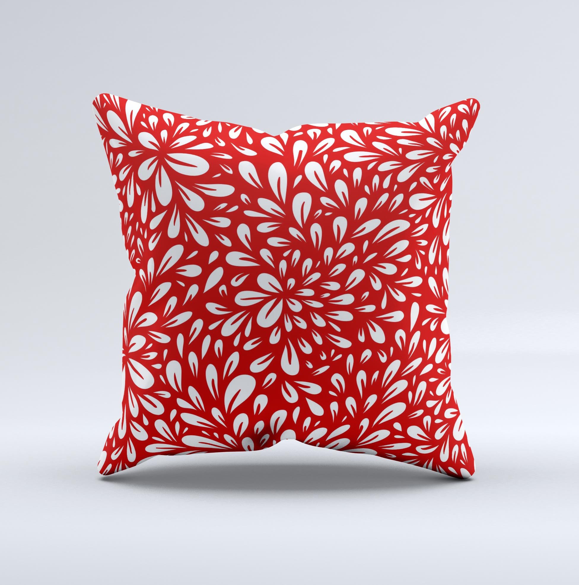 Bright red and white floral decorative throw pillow with intricate ink-fuzed design, showcasing a unique handmade quality.