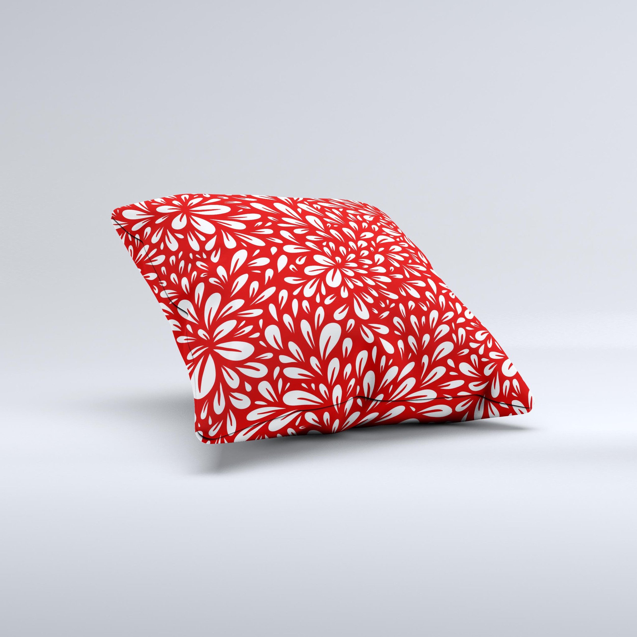 Bright red and white floral decorative throw pillow with intricate ink-fuzed design, showcasing a unique handmade quality.