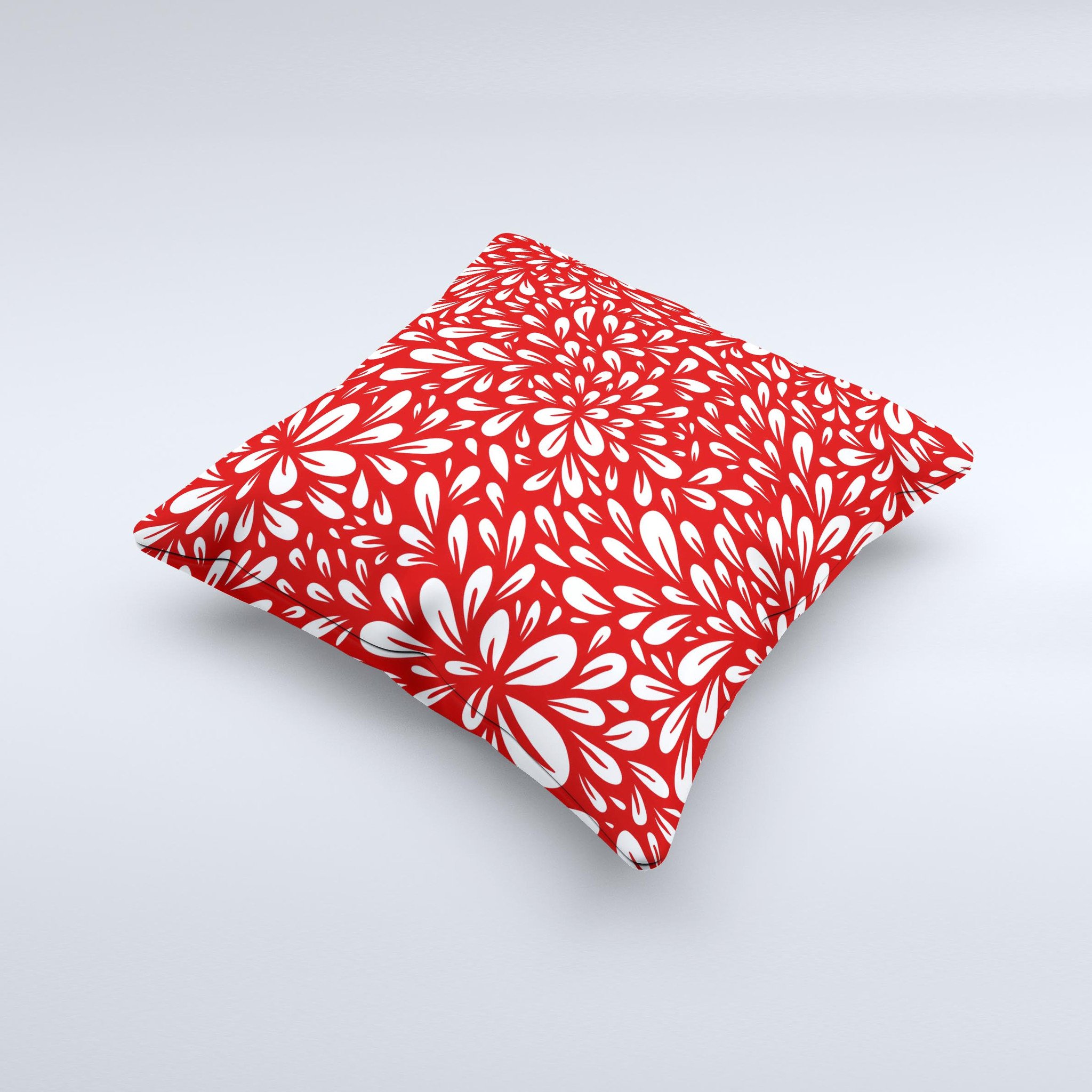 Bright red and white floral decorative throw pillow with intricate ink-fuzed design, showcasing a unique handmade quality.