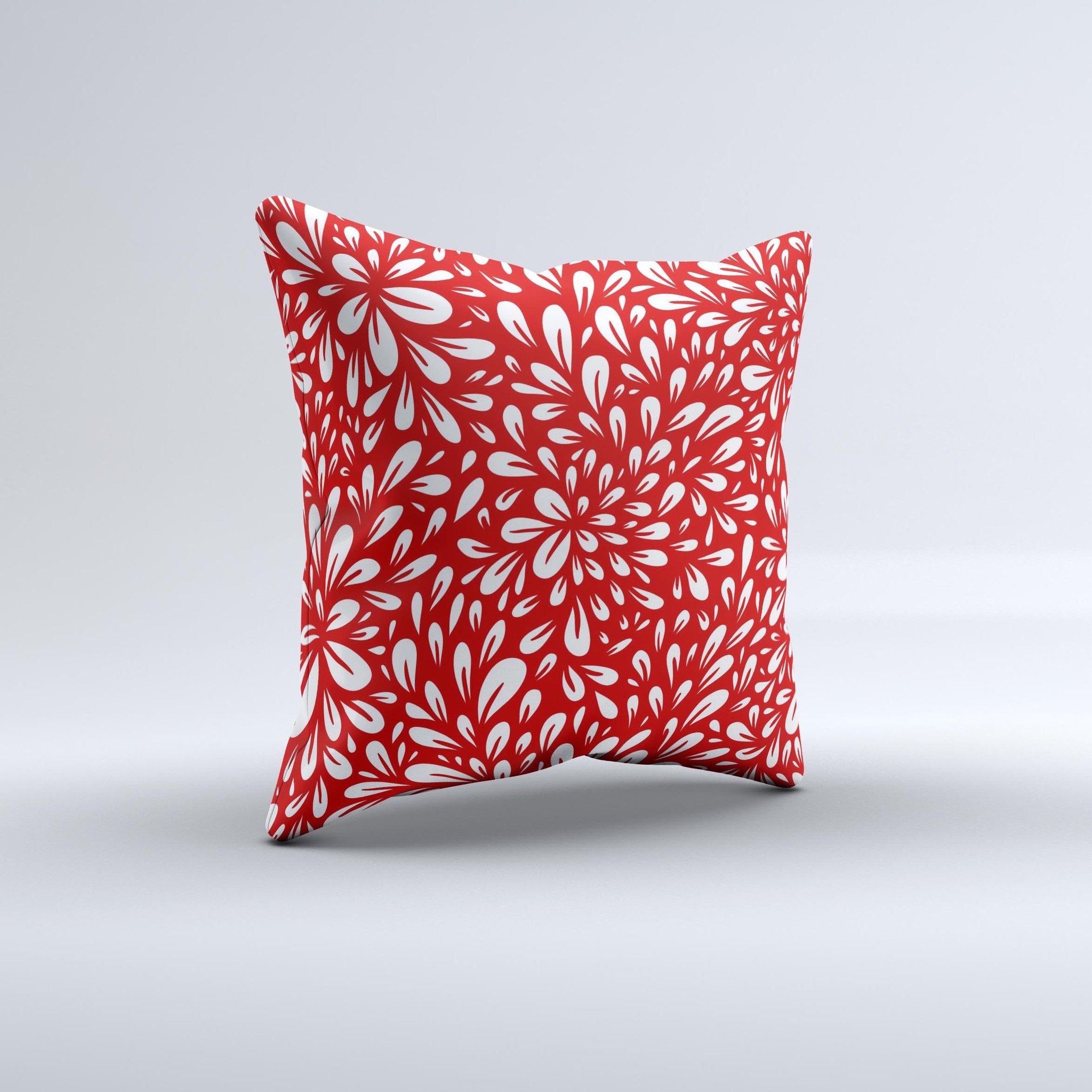 Bright red and white floral decorative throw pillow with intricate ink-fuzed design, showcasing a unique handmade quality.