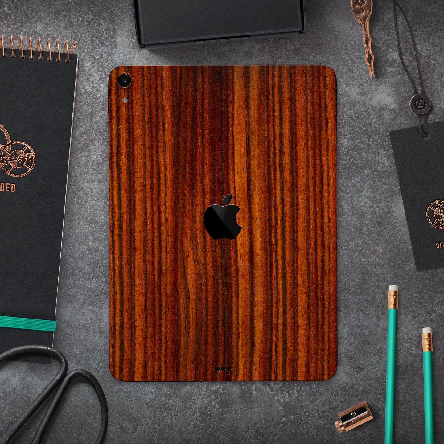 Bright Red Ebony Woodgrain skin decal for Apple iPad, showcasing its vibrant woodgrain design and ultra-thin profile.