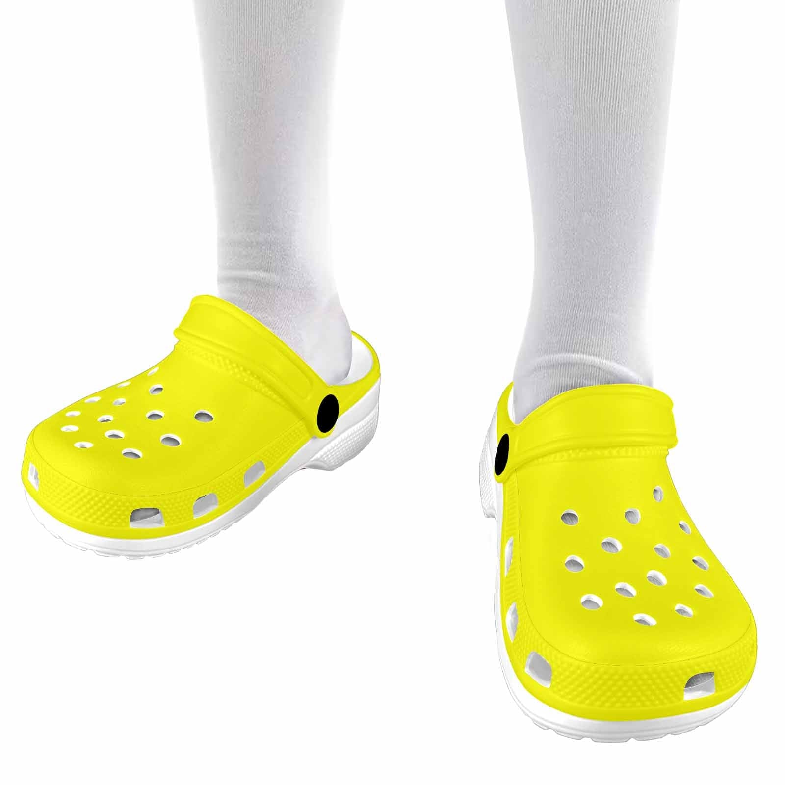 Bright yellow clogs designed for youth, featuring a slip-on style and ventilation ports for breathability.