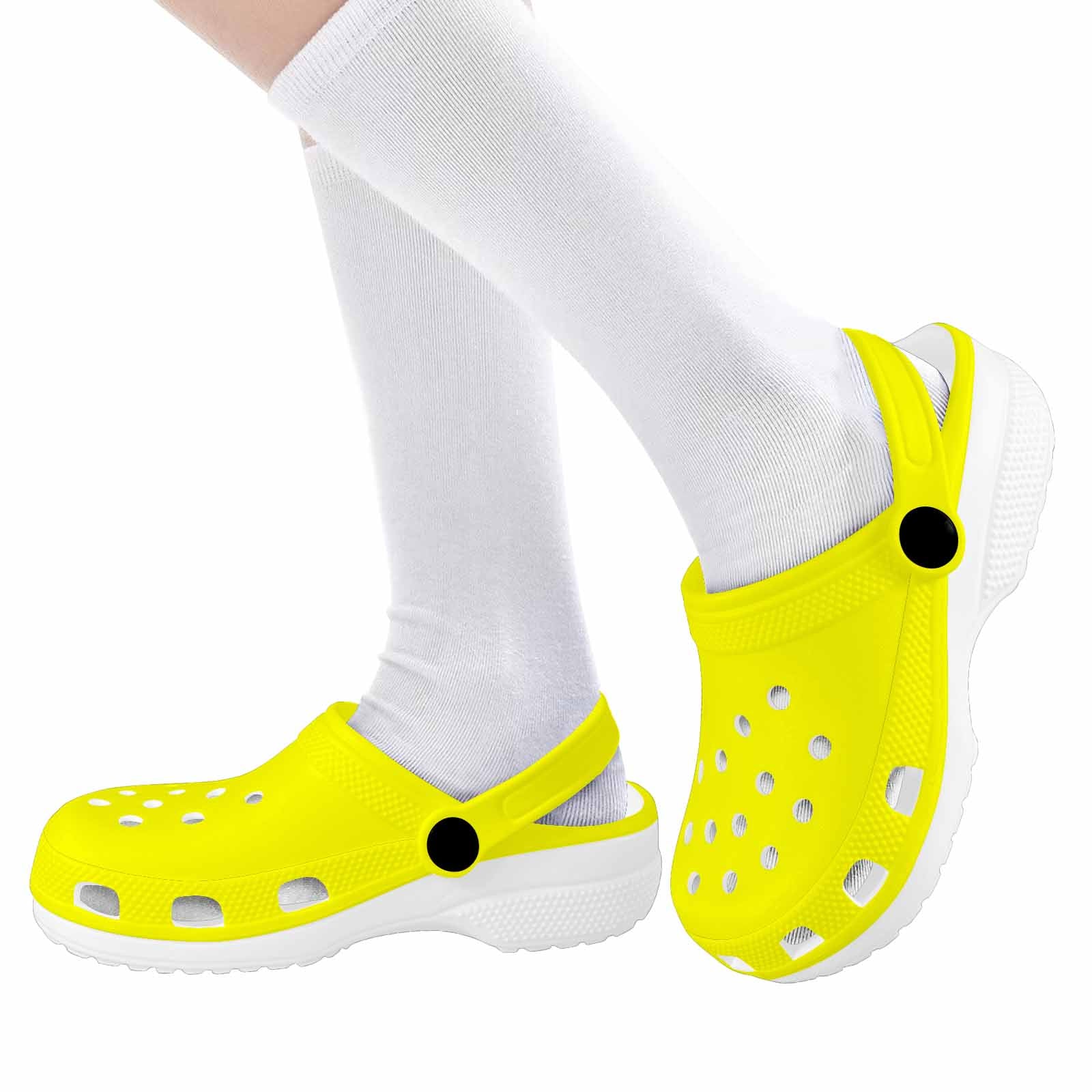 Bright yellow clogs designed for youth, featuring a slip-on style and ventilation ports for breathability.