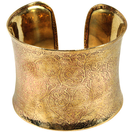 A beautifully handcrafted bronze cuff featuring intricate vine details, showcasing eco-friendly craftsmanship.