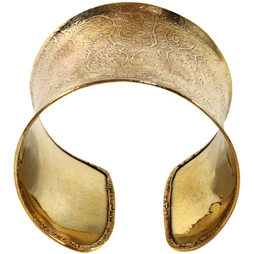 A beautifully handcrafted bronze cuff featuring intricate vine details, showcasing eco-friendly craftsmanship.