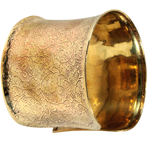 A beautifully handcrafted bronze cuff featuring intricate vine details, showcasing eco-friendly craftsmanship.