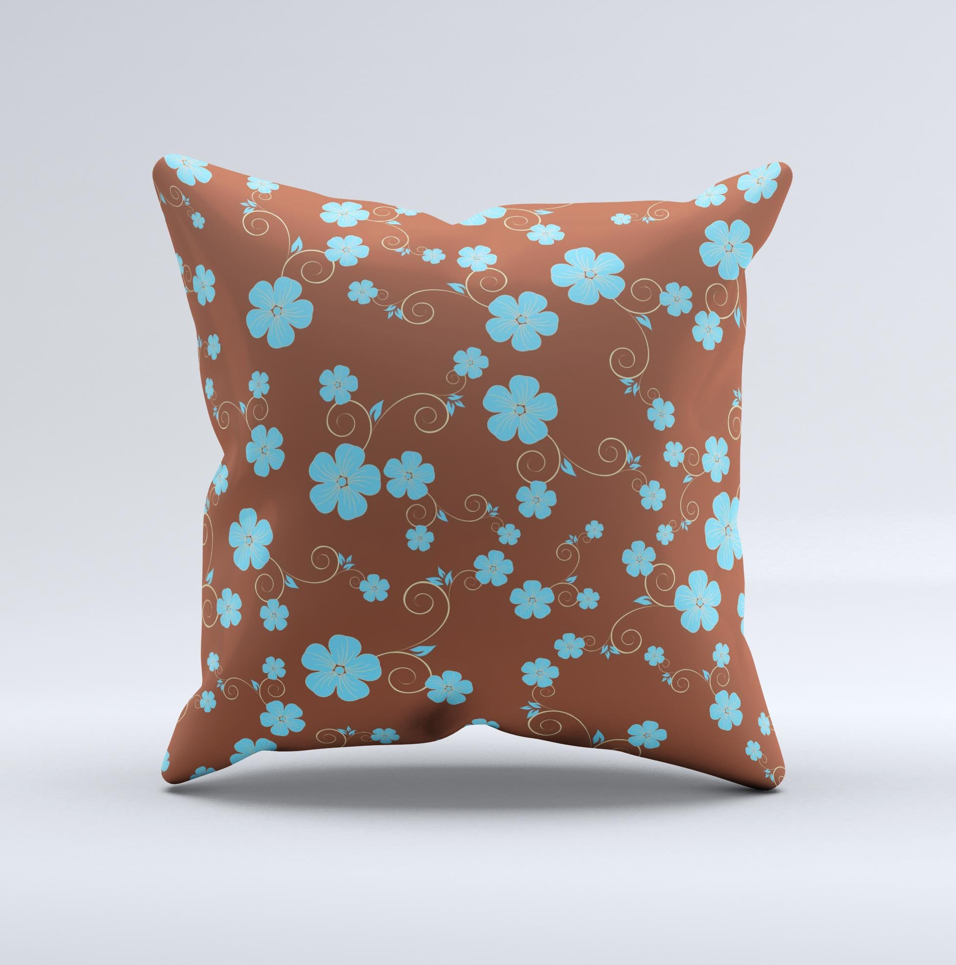 Brown and blue floral decorative throw pillow with intricate ink-fuzed design, showcasing a handcrafted appearance.