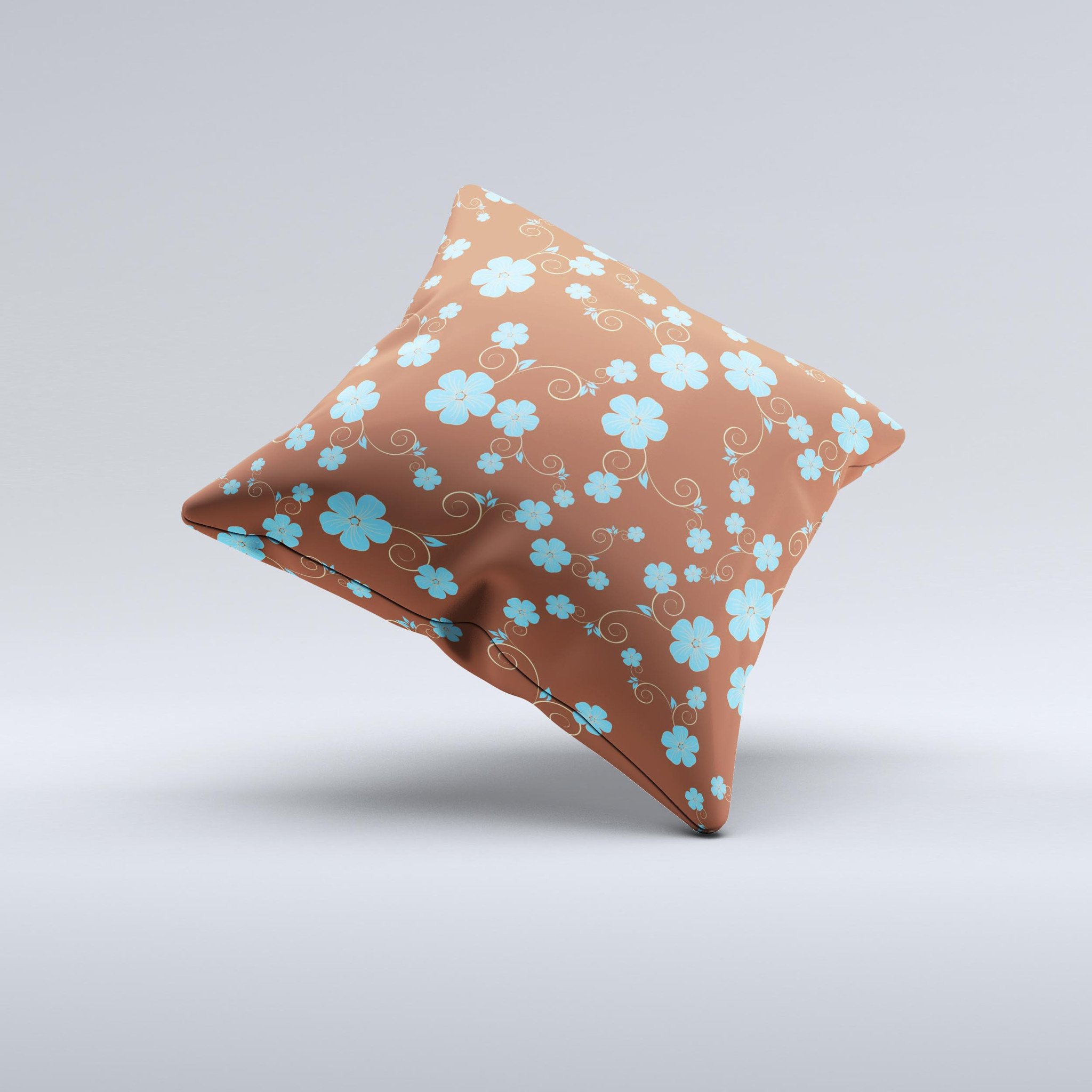 Brown and blue floral decorative throw pillow with intricate ink-fuzed design, showcasing a handcrafted appearance.