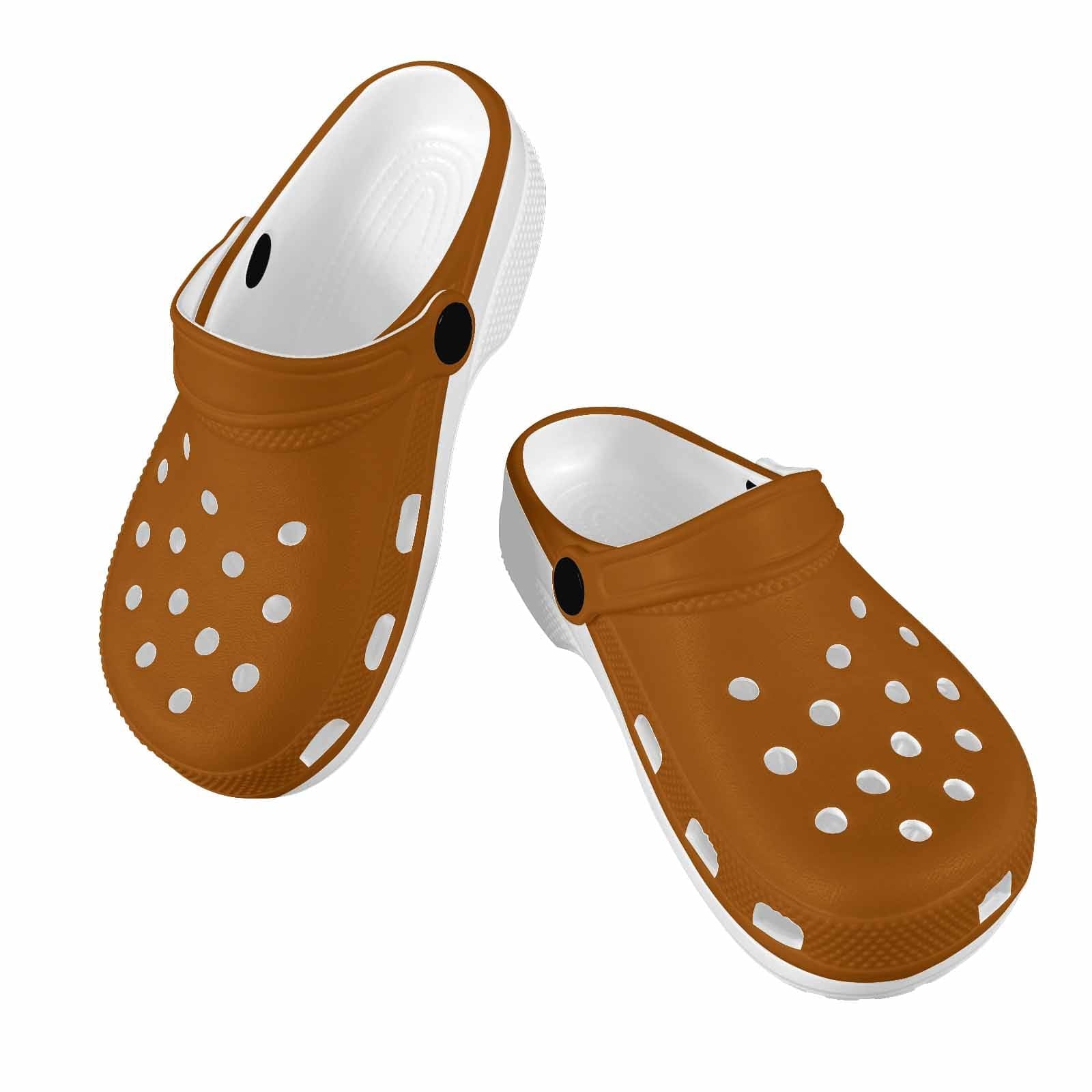 A pair of stylish brown clogs designed for youth, featuring a slip-on design, ventilation ports, and cushioned soles for comfort.