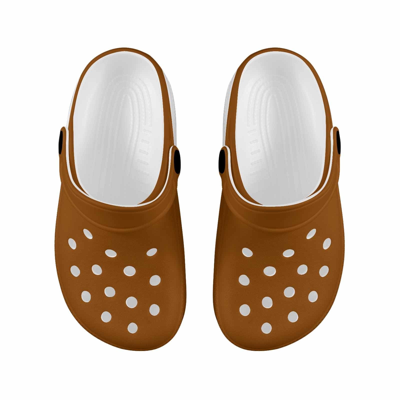 A pair of stylish brown clogs designed for youth, featuring a slip-on design, ventilation ports, and cushioned soles for comfort.