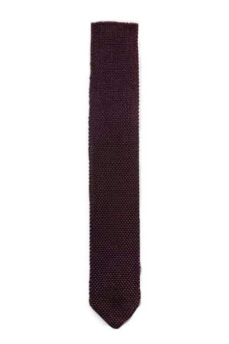 A stylish brown knitted tie with a pointed end, showcasing its texture and quality material.