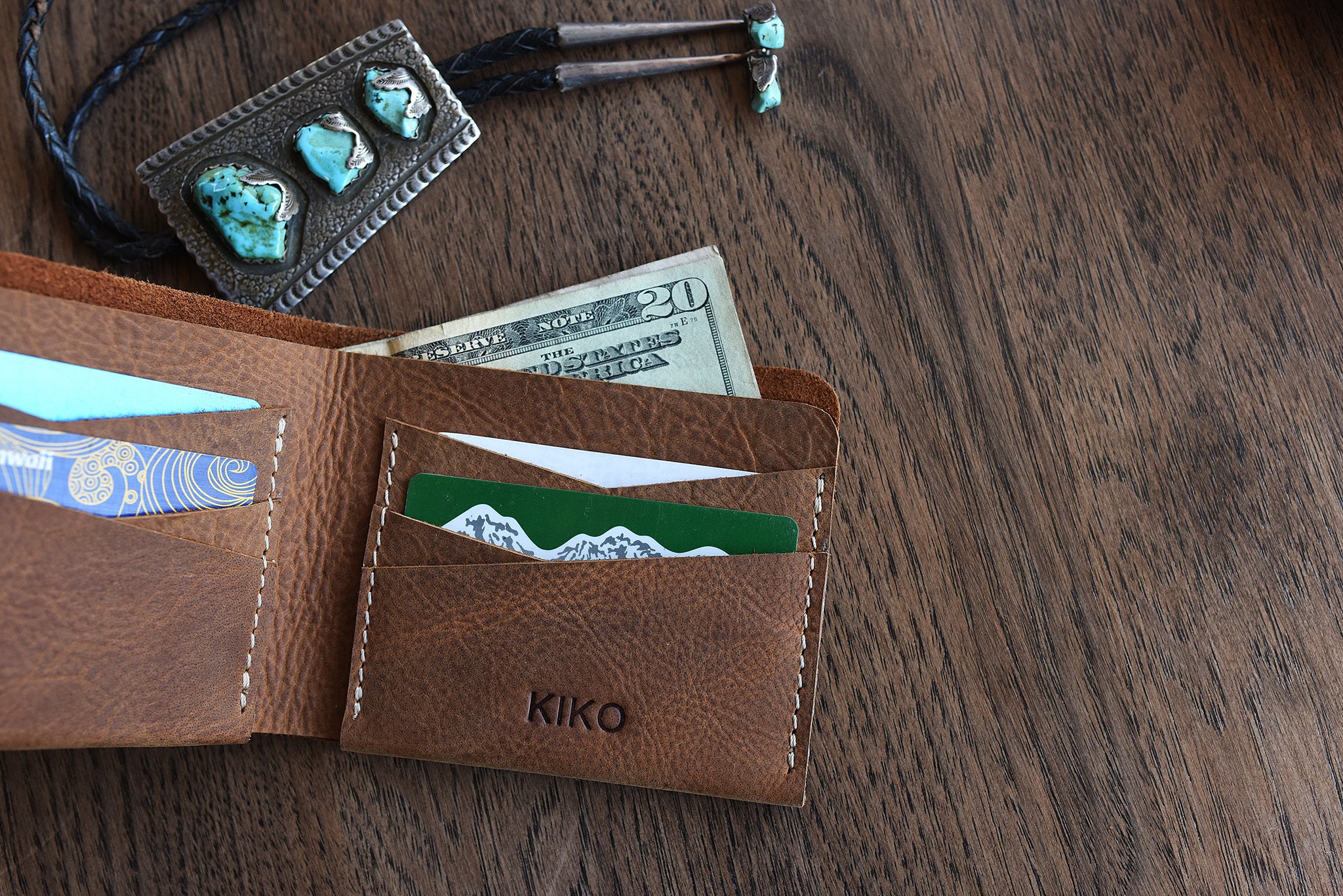 Buck Bifold wallet made of premium cowhide leather with six card slots and a smooth finish.