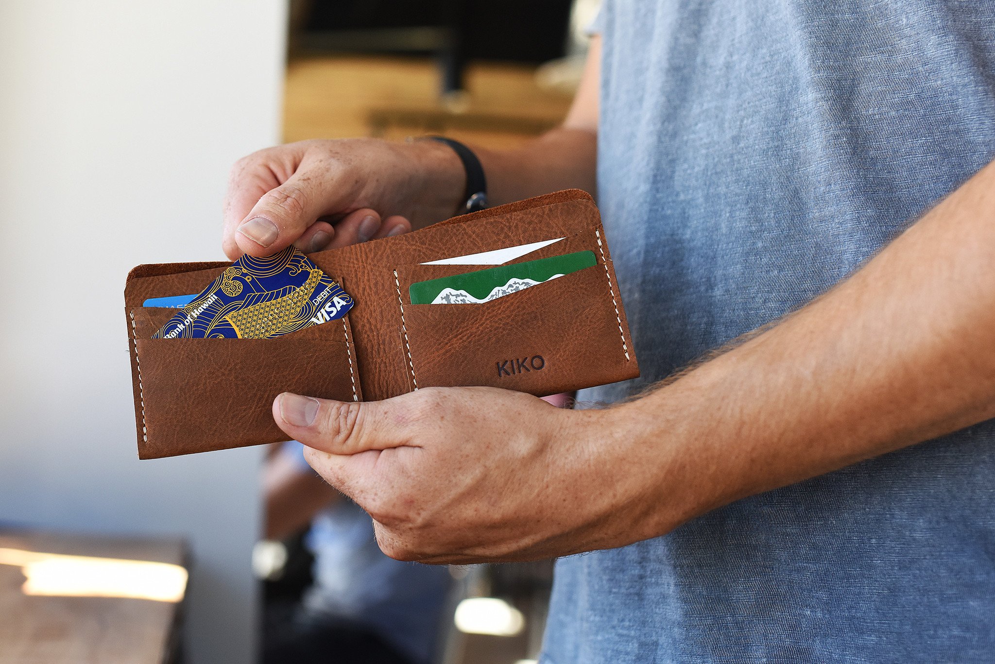 Buck Bifold wallet made of premium cowhide leather with six card slots and a smooth finish.