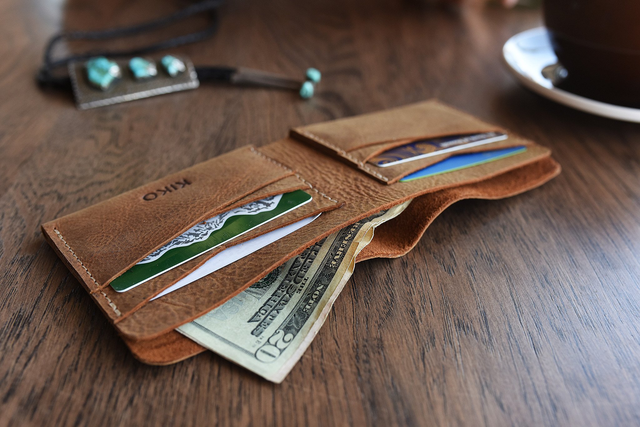 Buck Bifold wallet made of premium cowhide leather with six card slots and a smooth finish.