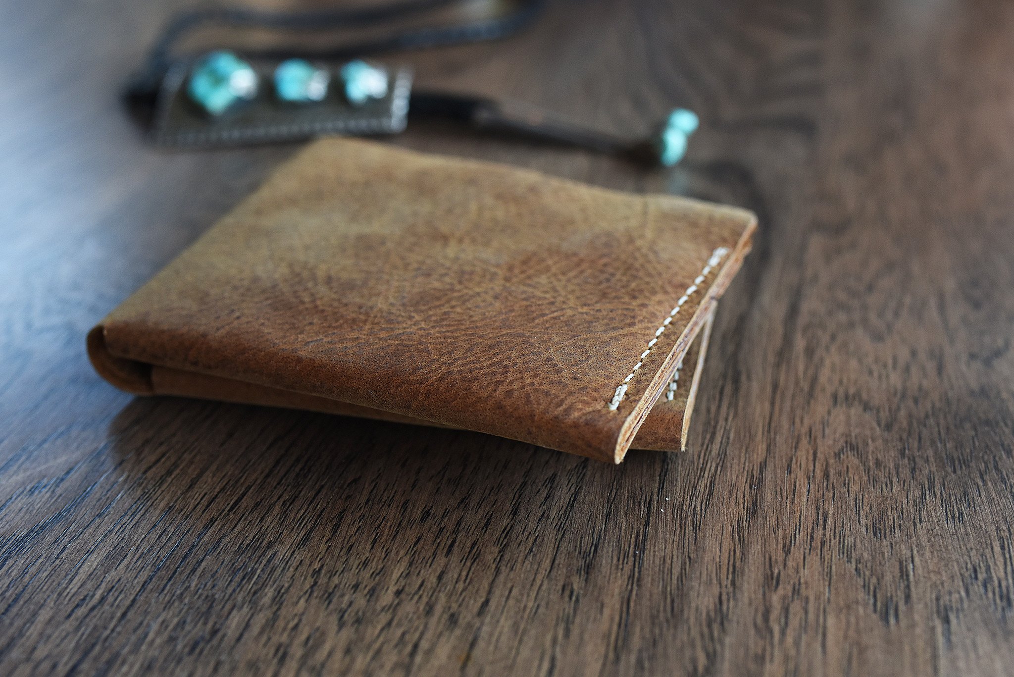 Buck Bifold wallet made of premium cowhide leather with six card slots and a smooth finish.