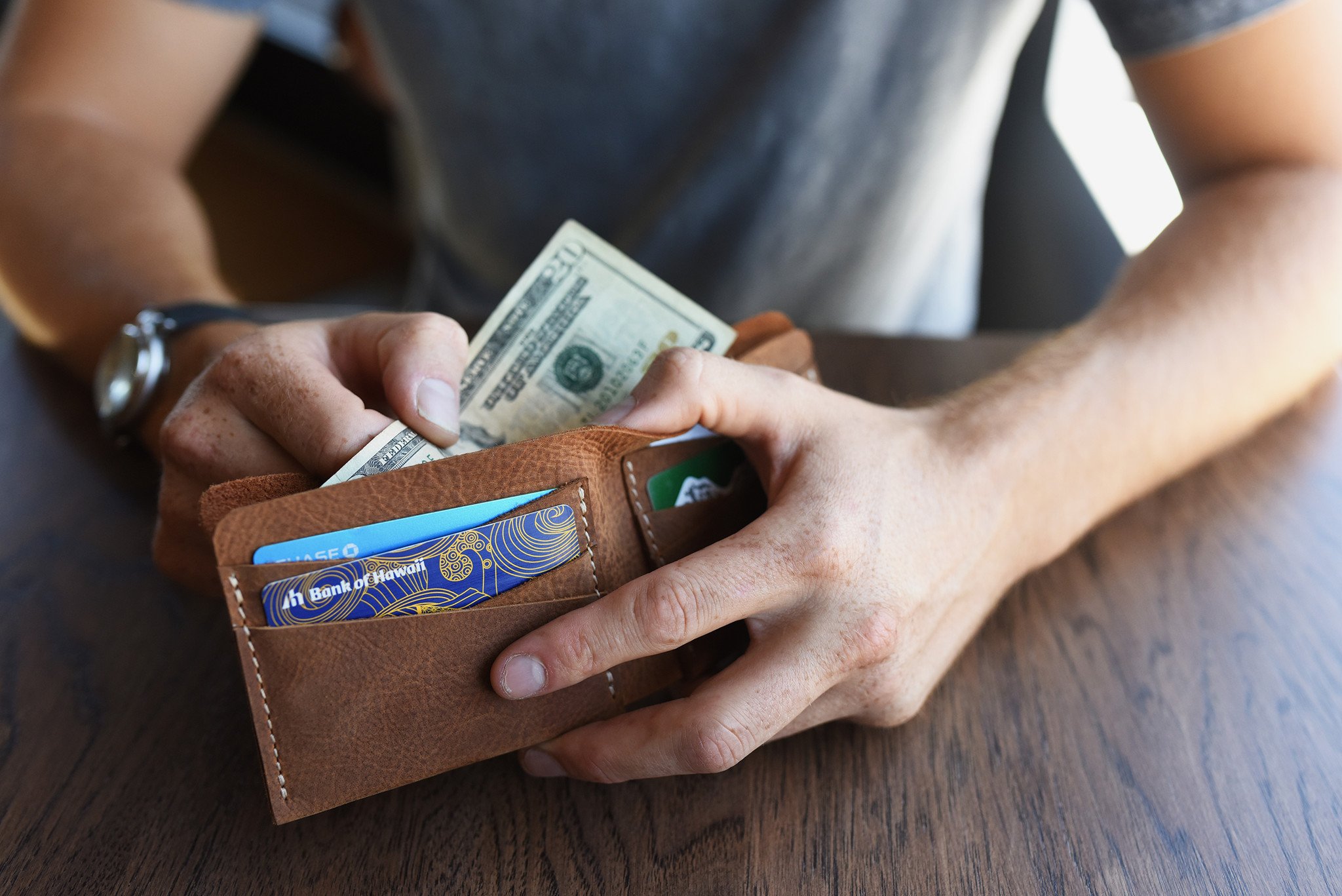 Buck Bifold wallet made of premium cowhide leather with six card slots and a smooth finish.