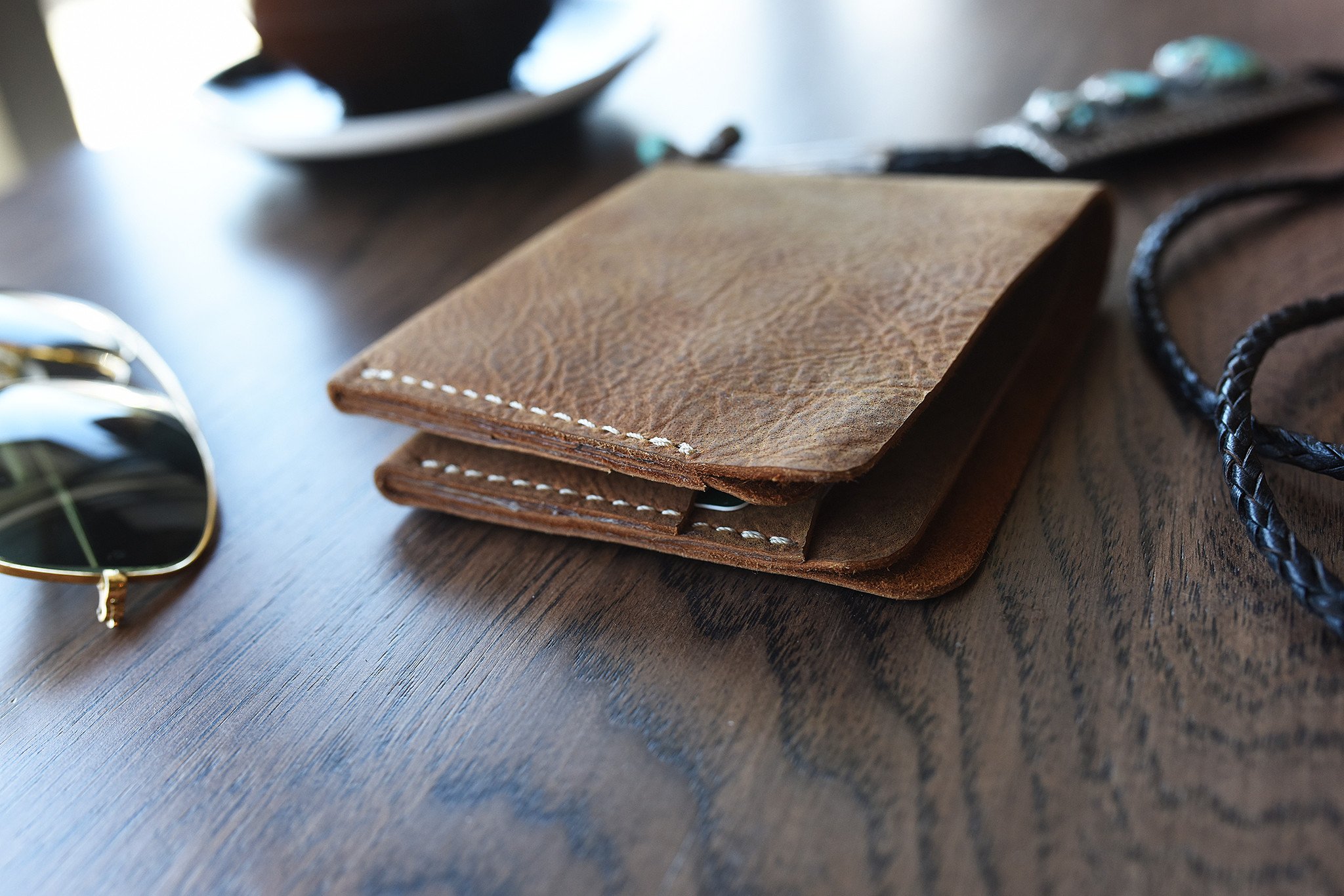 Buck Bifold wallet made of premium cowhide leather with six card slots and a smooth finish.