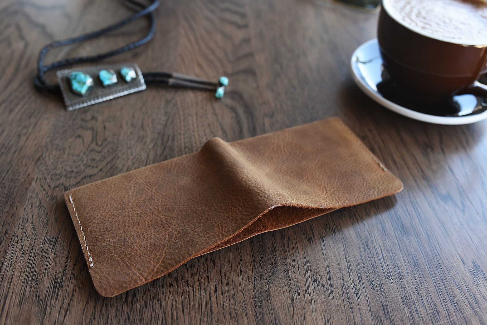 Buck Bifold wallet made of premium cowhide leather with six card slots and a smooth finish.