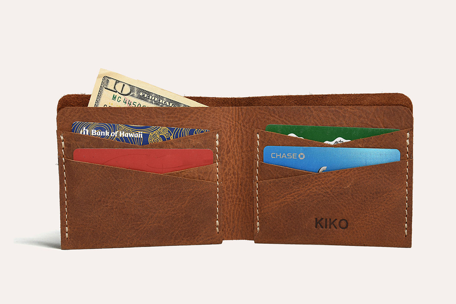 Buck Bifold wallet made of premium cowhide leather with six card slots and a smooth finish.