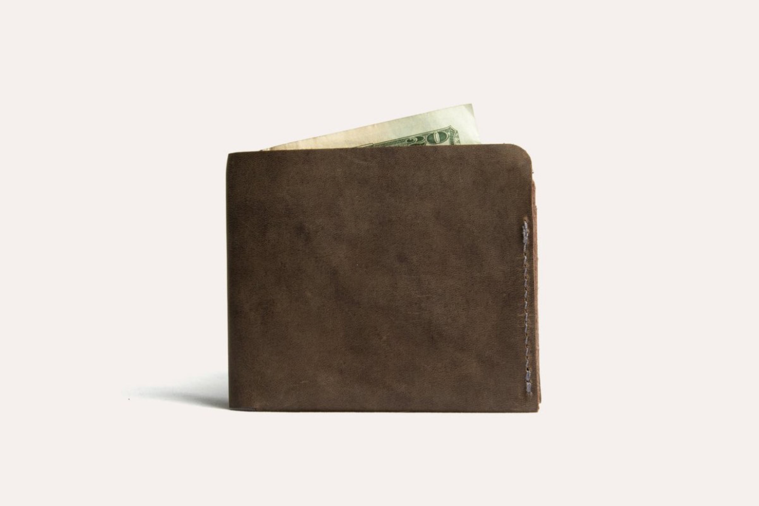 Buck Bifold wallet made of premium cowhide leather with six card slots and a smooth finish.