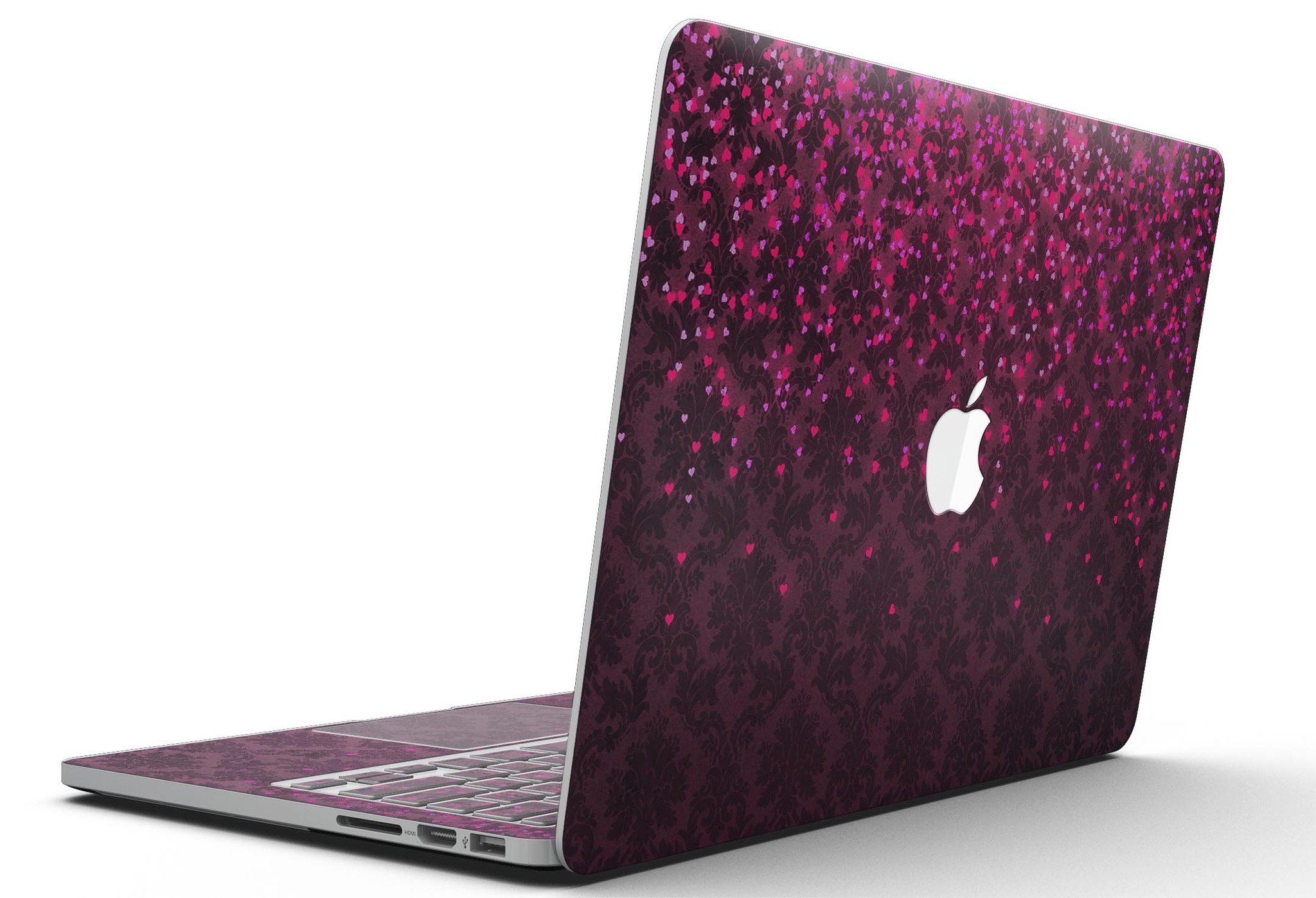 Burgundy Falling Micro Hearts skin for MacBook Pro with Retina Display, showcasing a stylish design that protects the device.