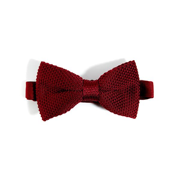 A stylish burgundy knitted bow tie displayed elegantly, showcasing its texture and color.