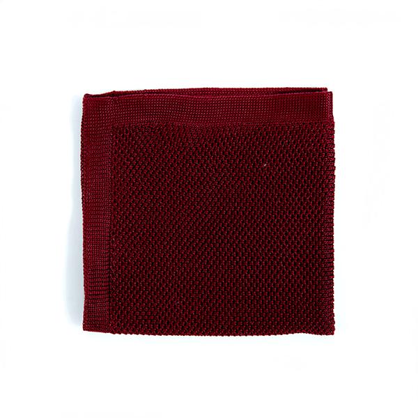 Burgundy knitted pocket square displayed elegantly, showcasing its rich color and soft texture.