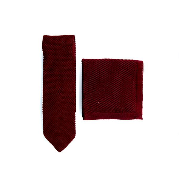 Burgundy knitted tie and pocket square set displayed elegantly, showcasing the rich color and texture.