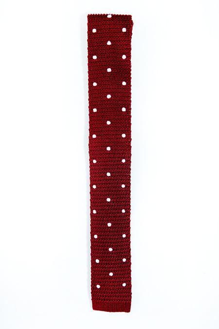 Burgundy silk knitted tie with white polka dots, featuring a square end design and 5.5cm width.