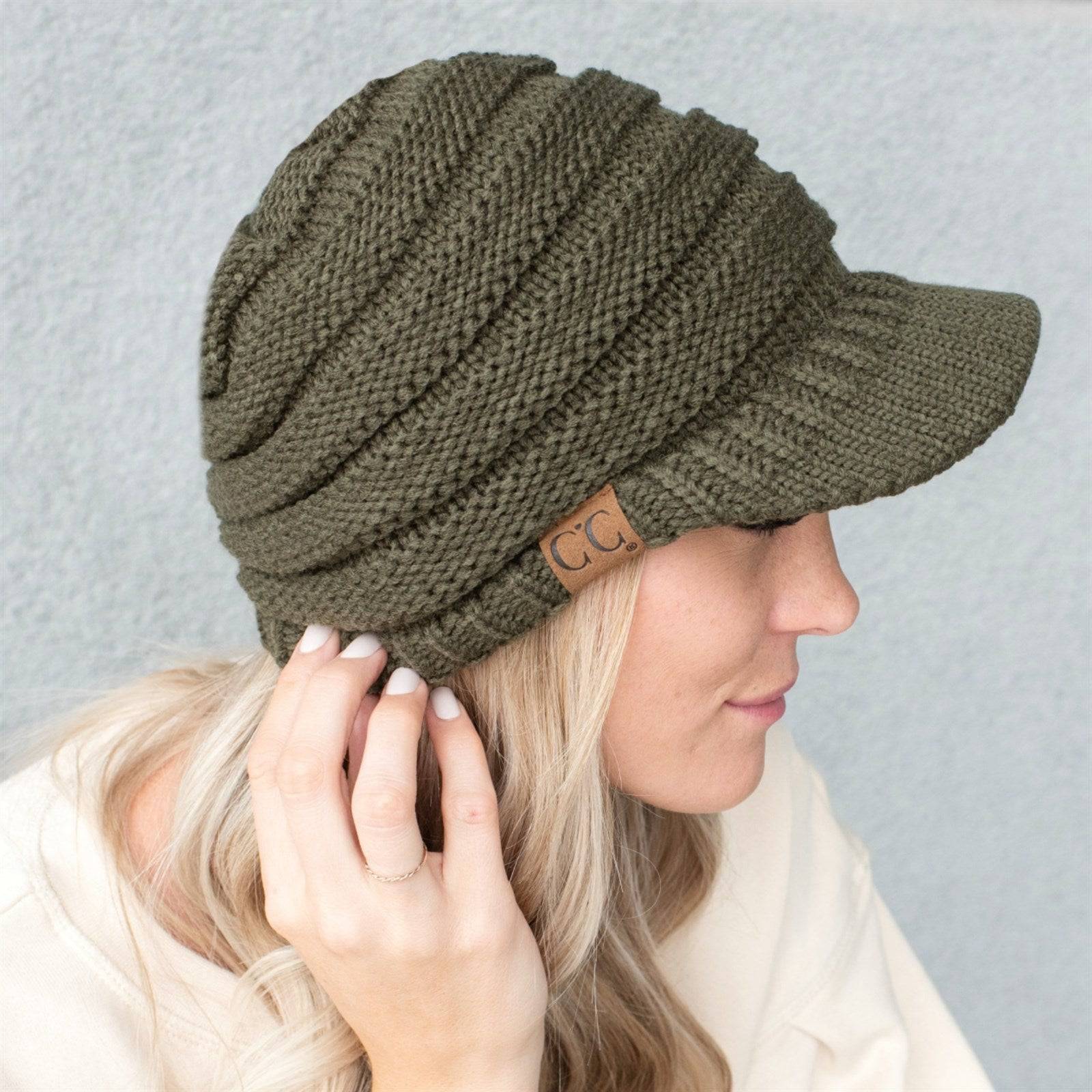 CC Beanie Brim Cap featuring a stylish brim and cable knit design, perfect for winter wear.