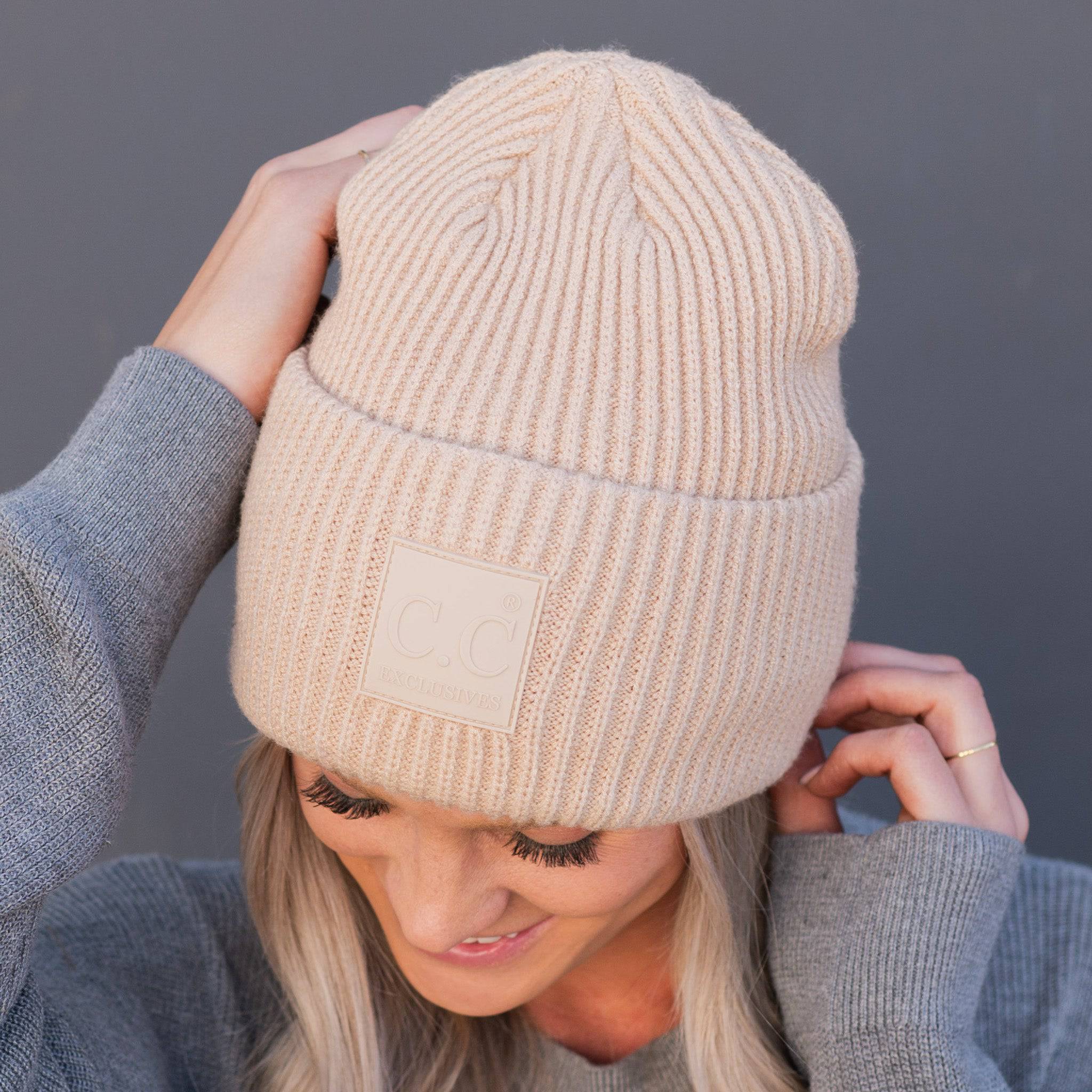 CC Beanie Cap featuring a solid ribbed knit design and a CC® Rubber Patch, perfect for teens and adults.