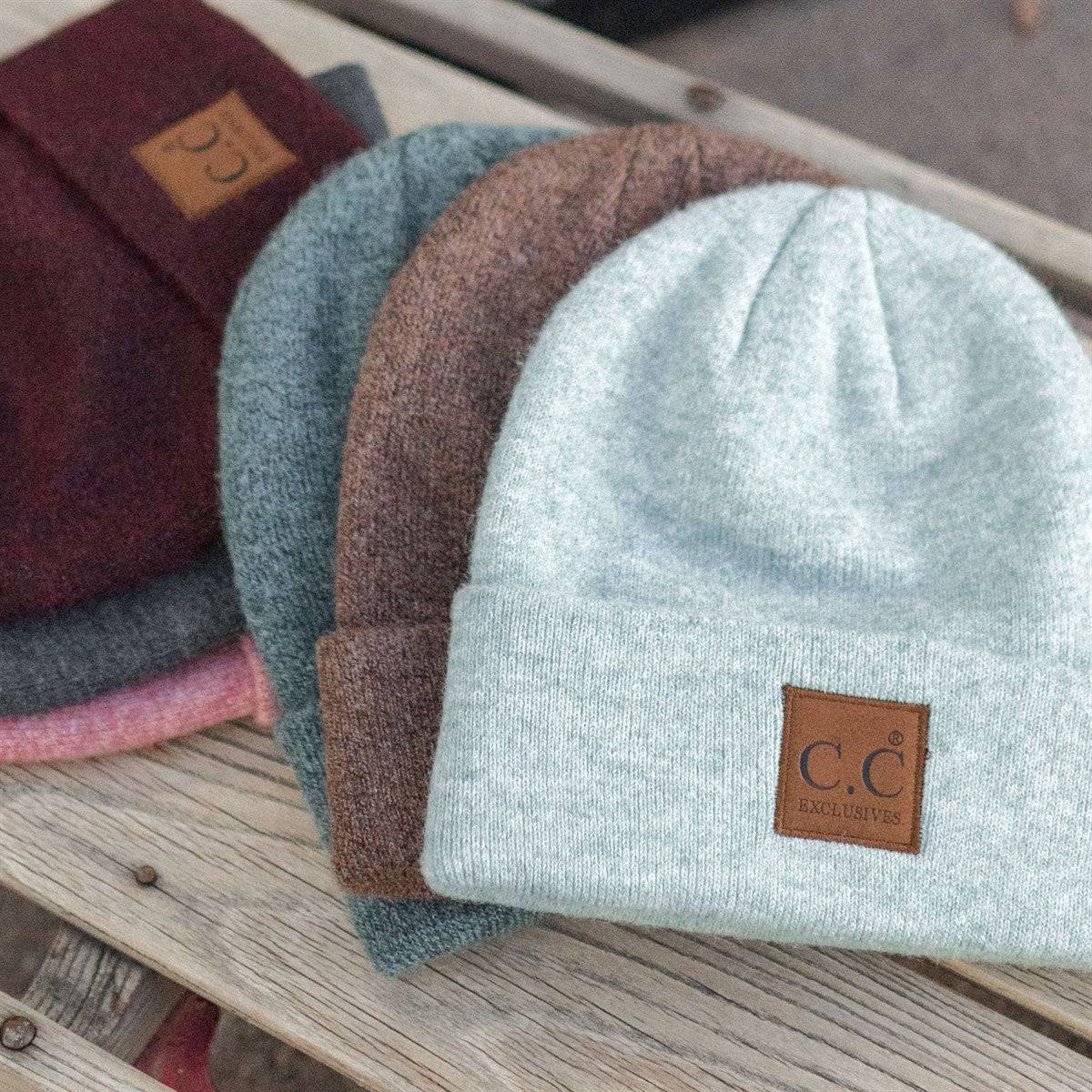 CC Beanie Heather Knit Basic in various colors, showcasing its unisex design and adjustable band.