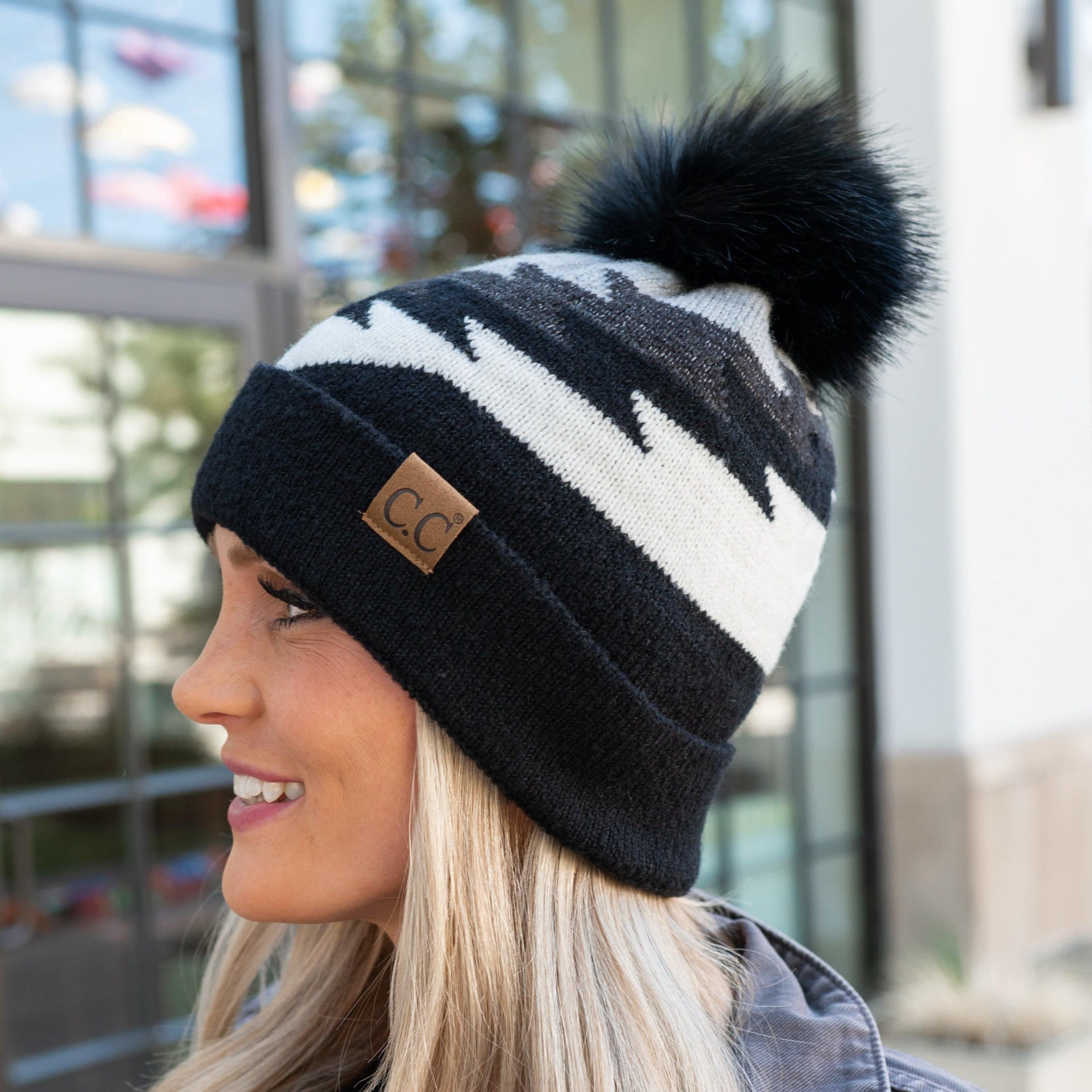 CC Beanie with Pom featuring a South Western Aztec pattern, showcasing its soft faux fur pom pom and vibrant design.