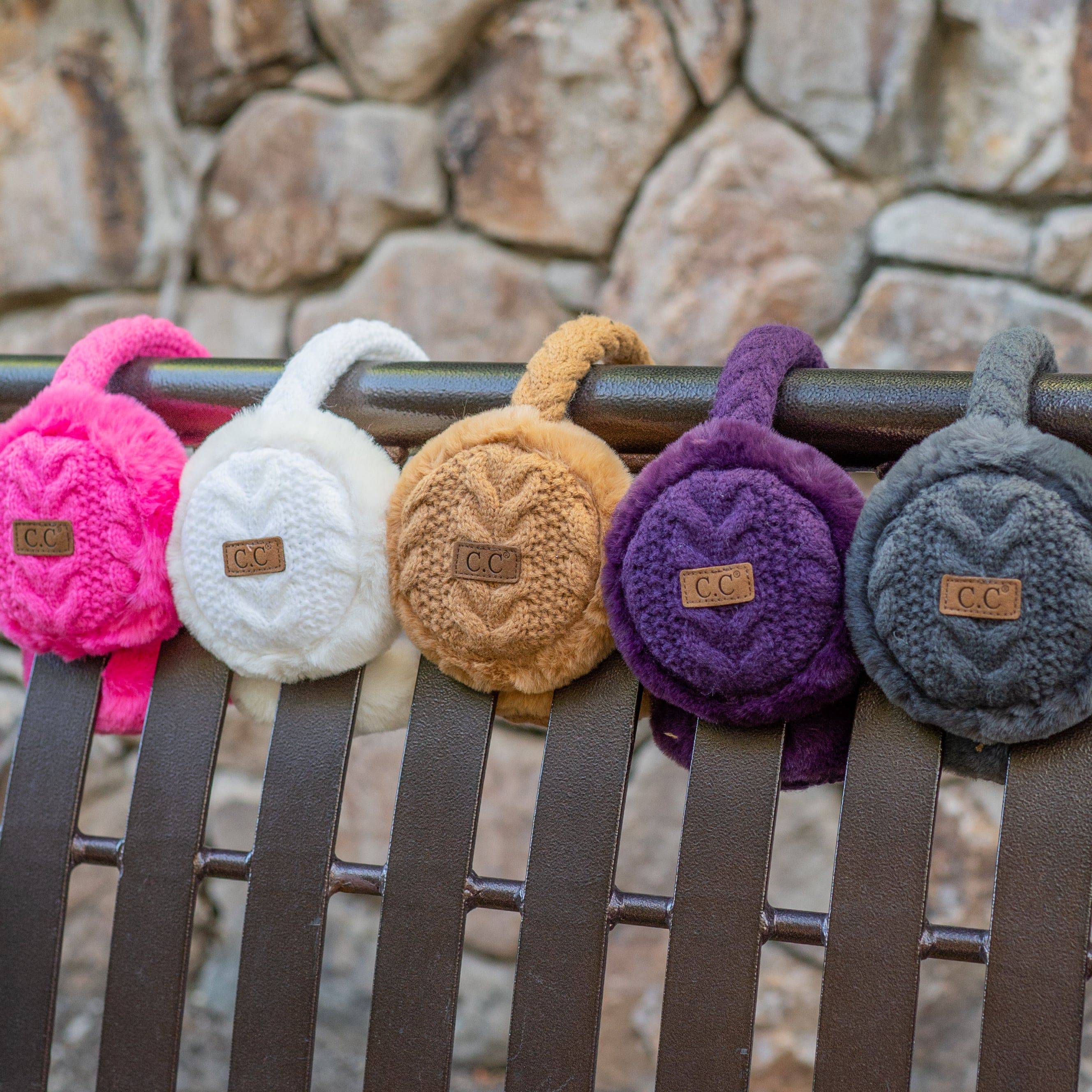 CC Cable Knit Earmuffs with cozy sherpa lining, adjustable fit, and stylish cable knit design in various colors.