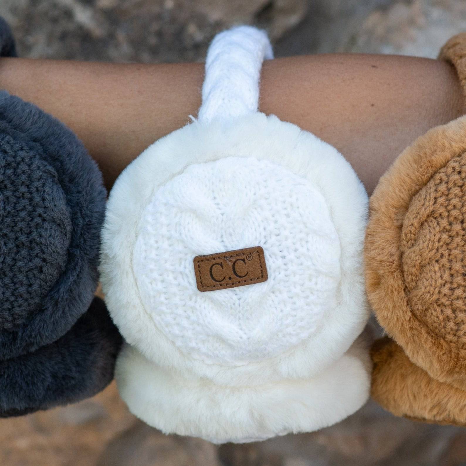 CC Cable Knit Earmuffs with cozy sherpa lining, adjustable fit, and stylish cable knit design in various colors.