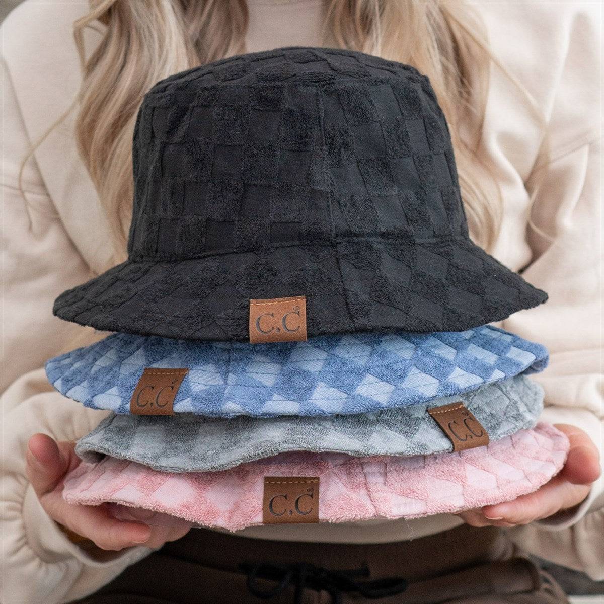 CC Checkered Terry Cloth Bucket hat featuring a stylish checkered pattern, adjustable strap, and lightweight terry cloth material.