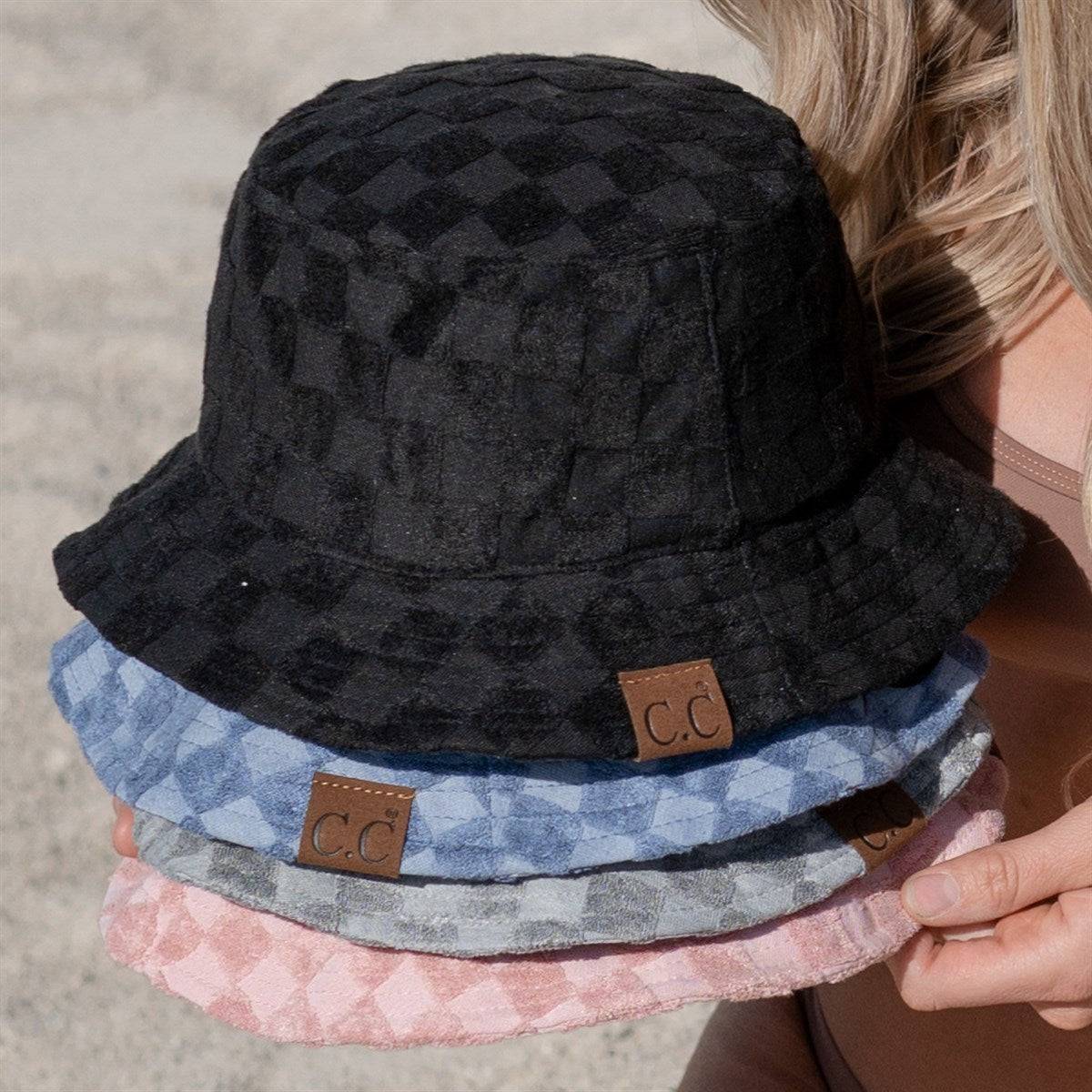 CC Checkered Terry Cloth Bucket hat featuring a stylish checkered pattern, adjustable strap, and lightweight terry cloth material.