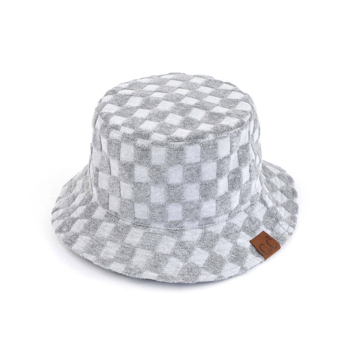 CC Checkered Terry Cloth Bucket hat featuring a stylish checkered pattern, adjustable strap, and lightweight terry cloth material.