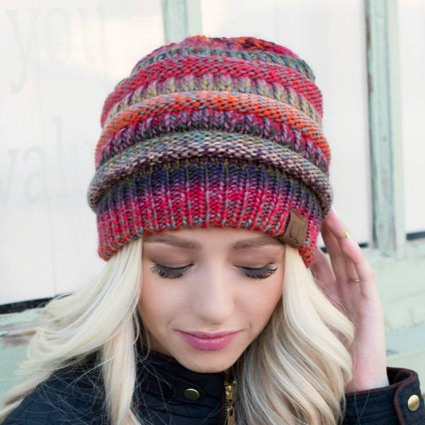 CC Comfy Striped Beanie featuring cable knit texture and multi-color yarn, perfect for cold weather.