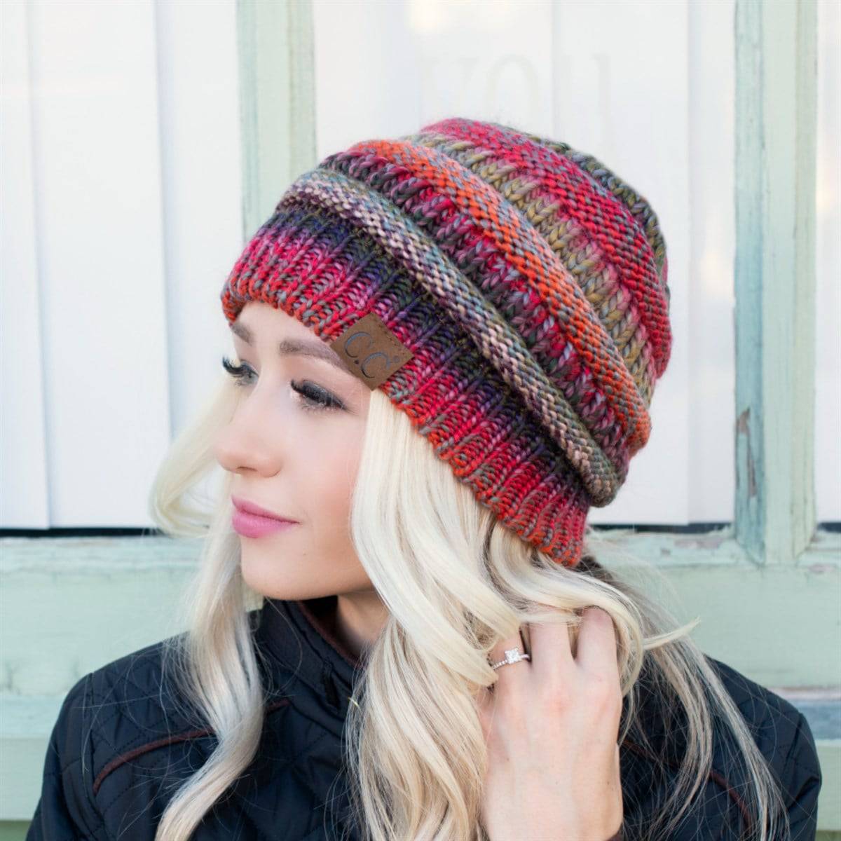 CC Comfy Striped Beanie featuring cable knit texture and multi-color yarn, perfect for cold weather.