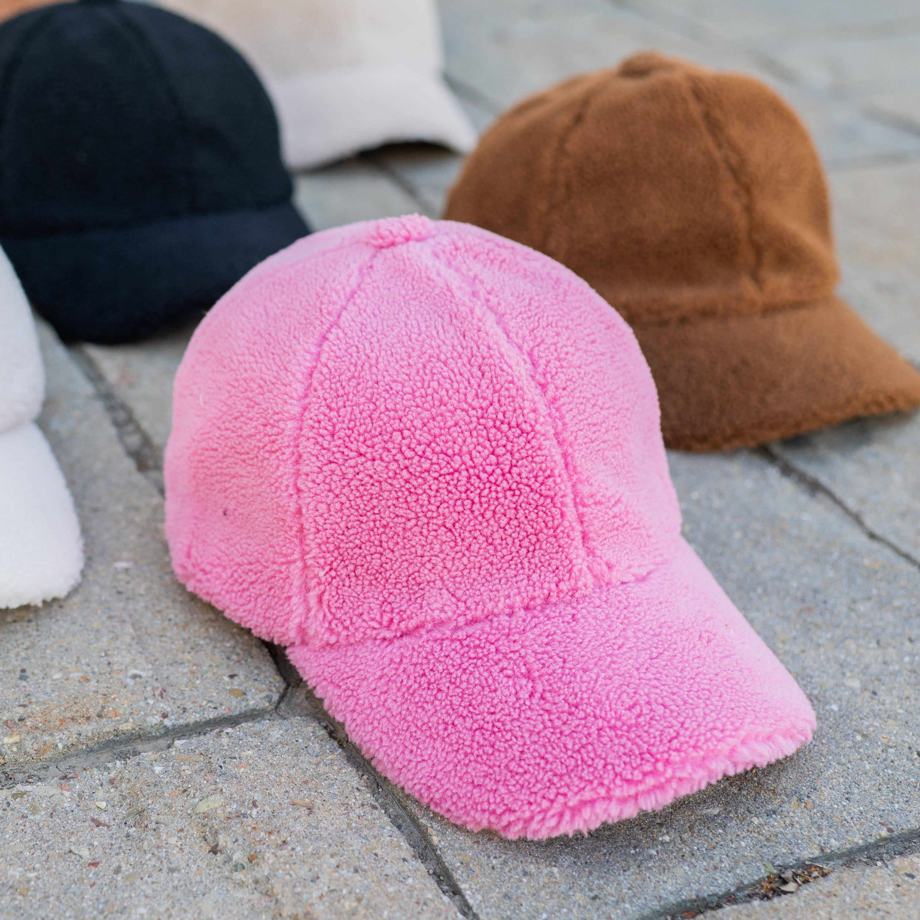 CC Cozy Sherpa Cap featuring soft sherpa material and adjustable velcro strap, suitable for youth and adults.